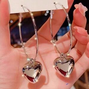 Silver Hoop Earrings with Dangling Heart Charms